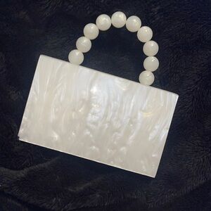 NWOT Akira white pearl clutch